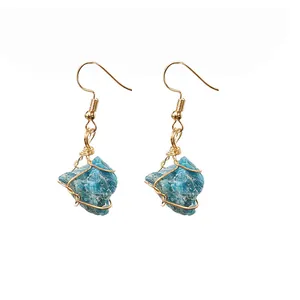 Handmade raw blue crystal wire wrapped earrings with gold-toned hooks in a pair