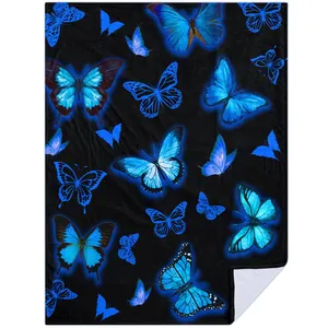 Detailed view of dreamy blue butterfly digital print on soft black flannel blanket.