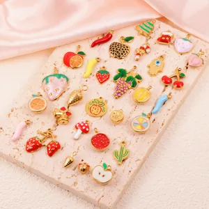 Close-up of diverse stainless steel enamel fruit and holiday charms for DIY jewelry making