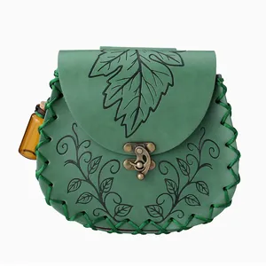 Detail view of a green steampunk cosplay belt bag with leaf engravings and a small vial