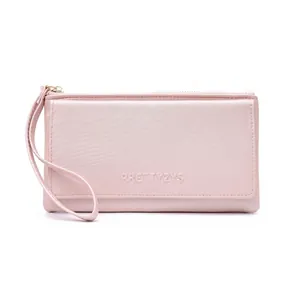 Close-up of a pink faux leather long wallet with wrist strap and embossed lettering