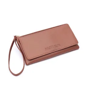 Detail showing textured brown minimalist leather wallet for women with card slots