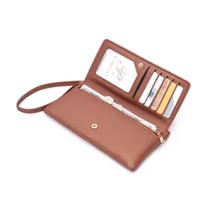 Detail showing interior of brown long wallet with card slots and zipper compartment