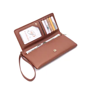 Detail showing interior compartments and card slots of brown long leather wallet
