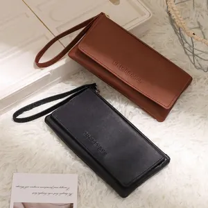 Elegant brown and black faux leather long wallets with wrist straps and embossed logo detail
