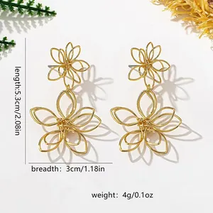 Elegant golden hollow flower drop earrings with vintage design and lightweight feel