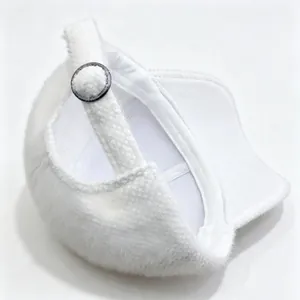 Close-up of white plush baseball cap showing soft texture and adjustable strap