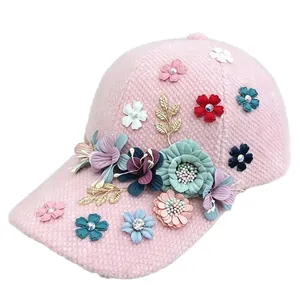 Stylish pink plush baseball cap for women with colorful 3D flower and rhinestone accents