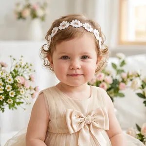 Detail view of a cute toddler girl wearing a white daisy embroidered floral headband