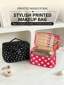 Close-up detail of a printed makeup bag showing interior brush slots and storage space