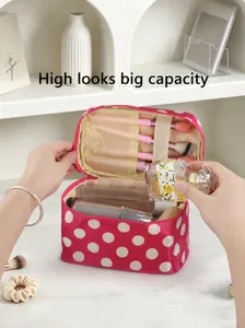 Detailed interior view of red polka dot makeup bag featuring large capacity brush slots