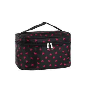 Black square portable makeup bag with red heart pattern and top handle for travel storage