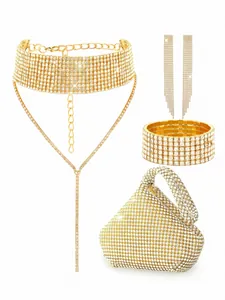Detailed view of luxury gold rhinestone bridal jewelry set including clutch bag