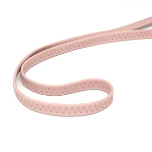 Close-up of pink PU leather shoulder strap showing detailed zig-zag stitching pattern