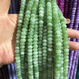 Macro detail view of smooth 5x8mm green chalcedony abacus beads for DIY jewelry