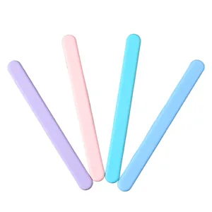 Close-up of four colorful reusable silicone stir sticks for resin art DIY crafting