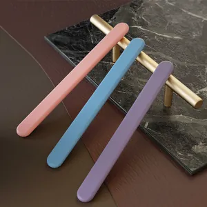 Macro view of three colorful silicone resin stirring sticks in pink, blue, and purple