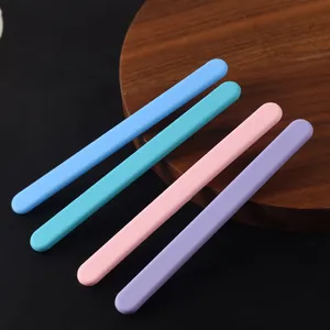 Detailed view of four colorful silicone stirring sticks for creative DIY resin art