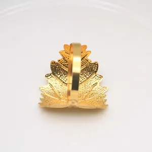 Elegant gold electroplated leaf metal napkin ring for luxury banquet table settings.