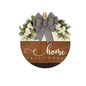 Rustic wooden Sweet Home door wreath sign with striped bow and white floral accents