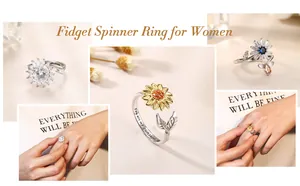 Detailansichten von Sonnenblumen-Fidget-Spinner-Ringen für Damen mit Gravur und Kristallen.