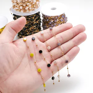Detail of colorful glass crystal beads on stainless steel chains for DIY jewelry making.