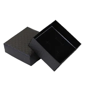 Detailed view of the elegant black textured jewelry gift box with a soft velvet insert