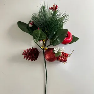 Close-up of a Christmas decorative pick with pine needles, red pine cones, and berry ornaments