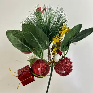 Detailed view of a Christmas pine branch with red glitter ball and pinecone decoration