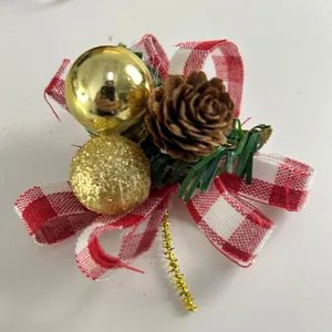 Christmas bow ornament with pine cone, gold balls and red checkered ribbon detail