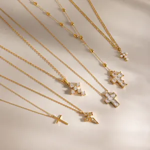 Variety of 18K gold plated stainless steel cross pendant necklaces with zircons and pearls.