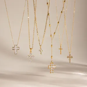 Detail view of 18k gold-plated stainless steel cross necklaces with zircon inlays