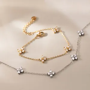 Elegant flower charm bracelet set with sparkling zircon stones in gold and silver plating