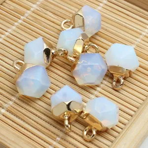 Detailed macro view of faceted white stone pendants with gold caps for DIY jewelry crafts