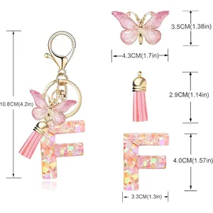 Detailed size chart for pink butterfly tassel initial F keychain with heart sequins