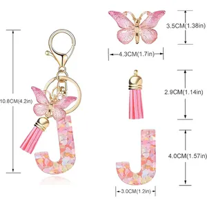 Detail view of letter J keychain with butterfly and pink tassel dimensions.