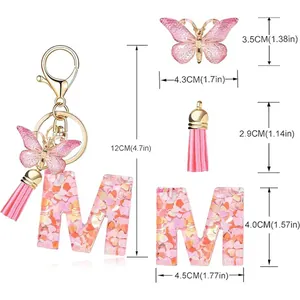Detailed size measurements for the pink butterfly and tassel letter M resin keychain