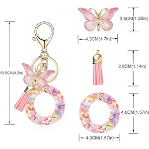 Detailed dimensions of a pink butterfly tassel keychain with colorful heart sequins