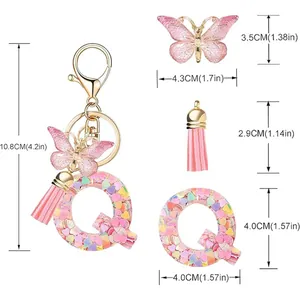 Detailed measurements of letter Q keychain with pink butterfly and tassel charms