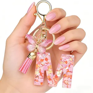 Pink heart sequin initial letter M keychain with butterfly and tassel handbag charm