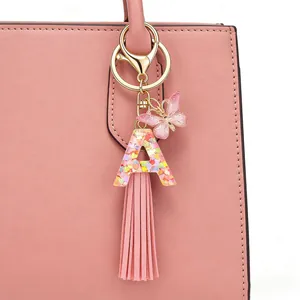 Pink initial A keychain with heart sequins, butterfly charm and long tassel bag ornament
