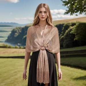 Elegant rose gold metallic hollow knit shawl featuring fringes and circular buckle
