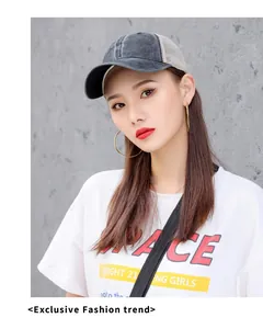 Detail view of a breathable washed denim mesh baseball cap worn by a fashion model