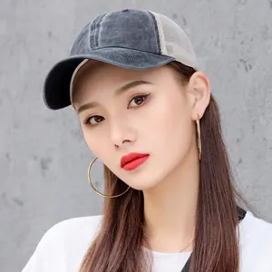 Breathable washed denim mesh trucker hat for sun protection in summer.