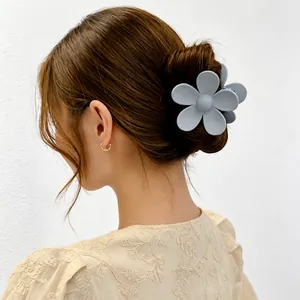Elegant matte grey flower hair claw clip for women's sophisticated bun hairstyles and updos