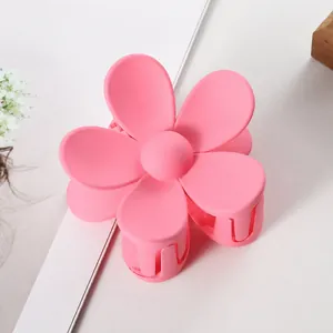 Matte pink flower hair claw clip for elegant hairstyles and daily hair styling use