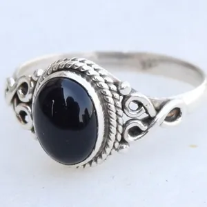 Vintage style silver ring with large oval black onyx stone and intricate filigree band design