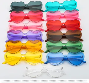 Group of colorful heart shaped rimless sunglasses in jelly colors and thick lenses.