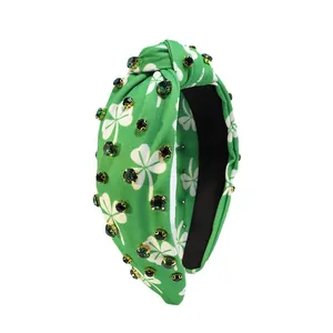 St. Patrick's Day green knotted headband with white shamrock print and rhinestones