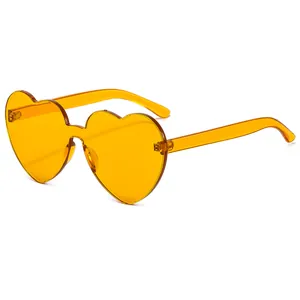 Trendy rimless heart-shaped sunglasses in vibrant yellow jelly color for women's fashion